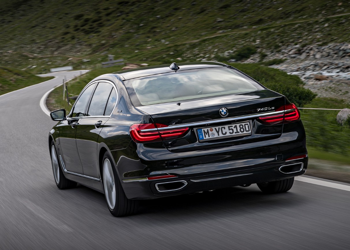 Black luxury sedan on winding road